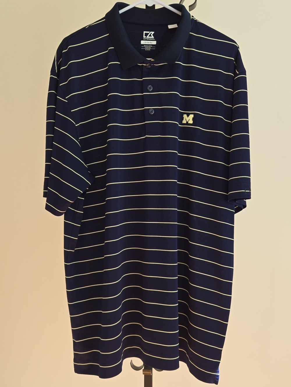 Cutter & Buck Navy Polo with Thin White Stripes and Gold 'M'